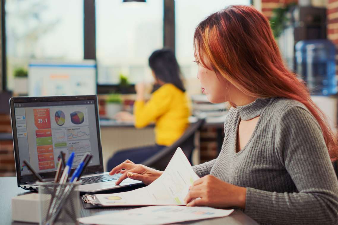 asian-woman-working-on-e-commerce-growth-in-busine-2022-04-11-14-56-45-utc-2