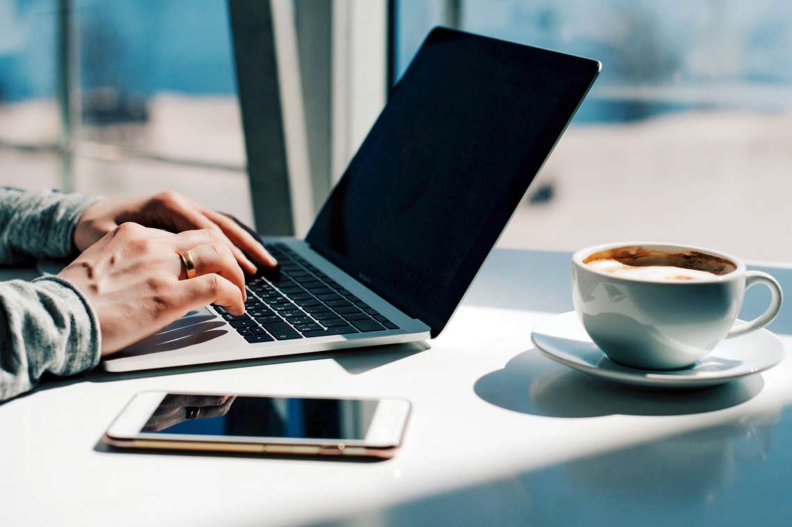 millennial-candid-authentic-man-using-laptop-and-p-2022-11-11-23-12-27-utc